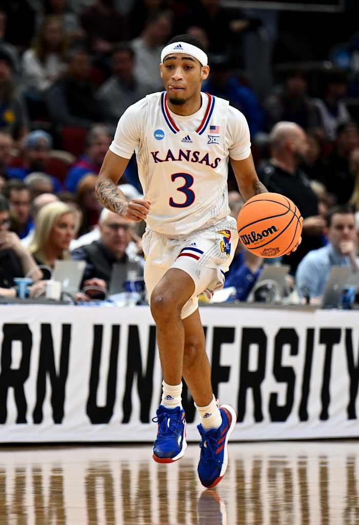 Mar 27, 2022; Chicago, IL, USA; Kansas Jayhawks guard Dajuan Harris Jr. (3) brings the ball up court during the first half against the Miami Hurricanes in the finals of the Midwest regional of the men's college basketball NCAA Tournament at United Center. Mandatory Credit: Jamie Sabau-USA TODAY Sports